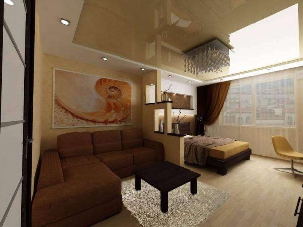 коричневый угловой диван в интерьере гостиной спальни 18 кв. метров
